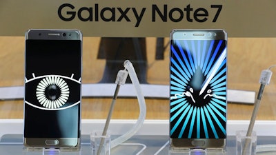 In this Oct. 11, 2016, file photo, Samsung Electronics Galaxy Note 7 smartphones are displayed at its shop in Seoul, South Korea. Samsung Electronics said in a statement Tuesday, July 18, 2017, it will recover gold and other metals in the recalled Galaxy Note 7 and retrieve components from the fire-prone phones to reduce wastes.