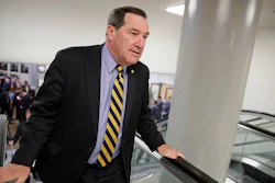 In this April 7, 2017, file photo, U.S. Sen. Joe Donnelly, D-Ind., arrives for the confirmation vote for Supreme Court nominee, Neil Gorsuch, on Capitol Hill in Washington. Donnelly railed against Carrier Corp. for moving manufacturing jobs to Mexico last year, even while he profited from a family business that relies on Mexican labor to produce dye for ink pads, according to records reviewed by The Associated Press.