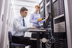 Team Of Technicians Using Digital Cable Analyser On Servers 518154685 5760x3840 5967834c0097a
