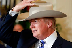 President Donald Trump tries on a Stetson hat during a 'Made in America,' product showcase featuring items created in each of the U.S. 50 states, Monday, July 17, 2017, at the White House in Washington. Stetson is base in Garland, Texas.