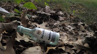 A discarded miniature bottle of Barcardi rum lies on the ground near Preble Street in Portland, Maine.