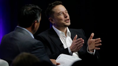 Tesla and SpaceX CEO Elon Musk responds to a question by Nevada Republican Gov. Brian Sandoval during the closing plenary session entitled 'Introducing the New Chairs Initiative - Ahead' on the third day of the National Governors Association's meeting Saturday, July 15, 2017, in Providence, R.I.