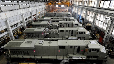 This photo taken Sept. 15, 2011, shows General Electric Evolution Series locomotives being assembled in Building 10 at GE Transportation in Lawrence Park Township, Erie County, Pa. Plant officials announced Thursday, July 27, 2017, that, after more than 100 years of production at the Erie-area plant, locomotive production, except for prototypes, by the end of 2018. All locomotive production is being transferred to GE Transportation's Fort Worth, Texas plant.
