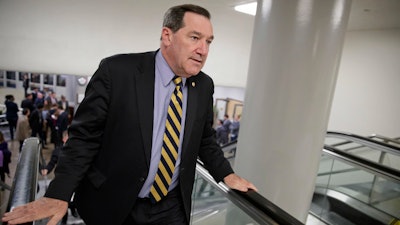 U.S. Sen. Joe Donnelly, D-Ind railed against Carrier Corp. for moving manufacturing jobs to Mexico last year, even while he profited from a family business that relies on Mexican labor to produce dye for ink pads, according to records reviewed by The Associated Press.