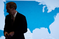 Microsoft President and Chief Legal Officer Brad Smith pauses in front of a monitor displaying the U.S. as he speaks in Washington, Tuesday, July 11, 2017, about Microsoft's project to bring broadband internet access to rural parts of the United States.