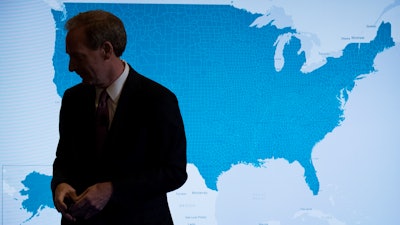 Microsoft President and Chief Legal Officer Brad Smith pauses in front of a monitor displaying the U.S. as he speaks in Washington, Tuesday, July 11, 2017, about Microsoft's project to bring broadband internet access to rural parts of the United States.