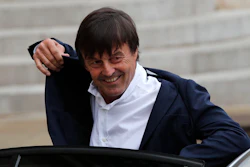 In this May 18, 2017 file photo, Environment Minister Nicolas Hulot arrives for the first weekly cabinet meeting under new French President Emmanuel Macron, at the Elysee Palace in Paris. Hulot unveiled a five-year plan to fight against climate change and fulfill the country's commitments under the Paris accord. Hulot said France will stop producing power from coal-power station by 2022.