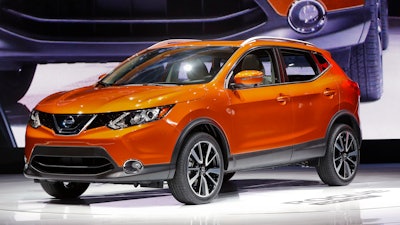 In this Jan. 9, 2017 file photo, the 2017 Nissan Rogue Sport is on display at the North American International Auto Show in Detroit. The alliance of Japanese automaker Nissan Motor Co. and Renault SA of France says it led in global vehicle sales for the first half of this year, the first time it has claimed top rank. The Nissan-Renault alliance, which includes Mitsubishi Motors Corp., sold nearly 5.3 million vehicles around the world in January-June.