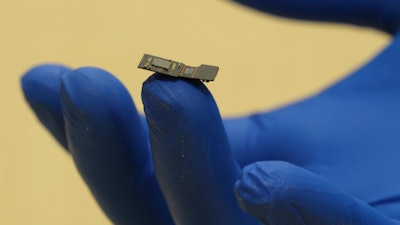 Rice University engineers have built a lab prototype of a flat microscope they are developing as part of DARPA's Neural Engineering System Design project. The microscope will sit on the surface of the brain, where it will detect optical signals from neurons in the cortex. The goal is to provide an alternate path for sight and sound to be delivered directly to the brain.