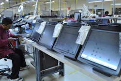 A technician repairs computer monitors at Amcor Service Solutions, a part of Tecma Group, which operates 18 maquiladoras for 33 companies in the Mexican northern border city of Ciudad Juarez, Mexico.