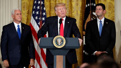 President Donald Trump, accompanied by Vice President Mike Pence, and House Speaker Paul Ryan of Wis., speaks in the East Room of the White House, Wednesday, July 26, 2017, in Washington. Trump is announcing the first U.S. assembly plant for electronics giant Foxconn in a project that's expected to result in billions of dollars in investment in the state and create thousands of jobs.