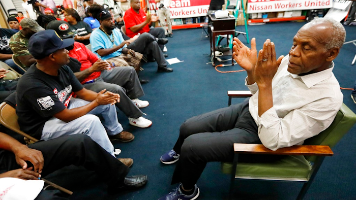 Actor and human rights activist Danny Glover, applauds with UAW members and Nissan employees at the UAW Canton, Miss., headquarters during a workers' rally, near the Nissan vehicle assembly plant, Tuesday, Aug. 1, 2017. Glover participated in the small rally to maintain workers' morale, while UAW workers set up an informational line outside employee entrances at the Nissan plant. The UAW has a vote scheduled Aug. 3-4, on whether it should represent the 3,700 full time company workers.