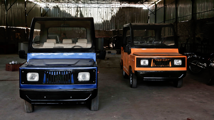 This Tuesday, Aug. 1, 2017 photo, shows new locally made Egyptian minicars parked inside a garage, in the village of Kerdasa, not far from the Giza Pyramids, greater Cairo, Egypt. Entrepreneur Ahmed Saeed el-Feki’s golf-cart looking minicar is different in design and mechanical efficiency from the Chinese Tuk Tuk, a three-wheeled motorized vehicle used as a taxi, which is popular in Egypt.