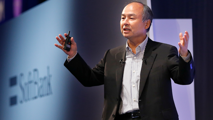 In this July 20, 2017 photo, SoftBank Group Corp. Chief Executive Officer Masayoshi Son speaks during a SoftBank World presentation in Tokyo. SoftBank said Monday, Aug. 7, 2017 its quarterly net profit was 5.5 billion yen ($50 million), down from 254 billion yen the previous year. Quarterly sales added 3 percent to 2.19 trillion yen ($20 billion).
