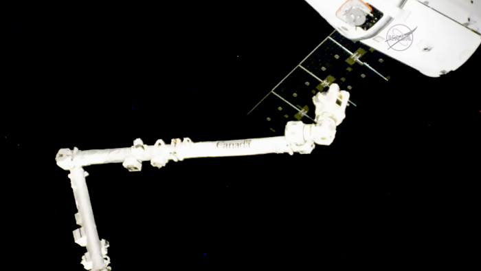 In this frame from NASA TV, the SpaceX Dragon capsule approaches the International Space Station on Wednesday, Aug. 16, 2017. The capsule pulled up Wednesday following a two-day flight from Cape Canaveral, Fla.