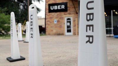 This May 26, 2017, file photo shows an Uber office in Austin, Texas. Ryan Graves, Uber's chief of global operations, resigned and investors sued the company’s former CEO. Graves told Uber staff in an email Thursday, Aug. 10, that he will transition out of his role as senior vice president of global operations in mid-September. That board, and its support for former CEO Travis Kalanick, was the subject of a lawsuit filed Thursday in Delaware Chancery Court by Benchmark Capital Partners.