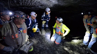In this Jan. 13, 2015 file photo, Joe Main, third from left, Assistant Secretary of Labor for Mine Safety and Health, and Patricia Silvey, center, Deputy Assistant Secretary for Operations with MSHA, speak with workers at the Gibson North mine, in Princeton, Ind. Deaths in U.S. coal mines this year have surged ahead of last year’s, and federal safety officials say the inexperience of those new to a mine could share the blame. Silvey said eight of the coal miners who died this year had less than a year’s experience at the mine where they worked.