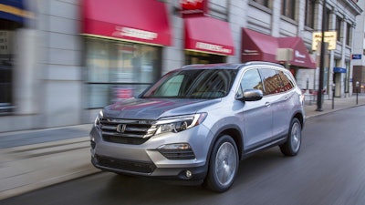 This photo provided by Honda shows the 2017 Honda Pilot, which ranks No. 9 in the Made in America Auto Index and is an Edmunds pick for a crossover. The Pilot has 78.5 percent domestic content and is built in Lincoln, Ala.