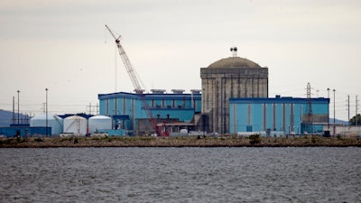 In this Sept. 21, 2016 file photo, Unit one of the V.C. Summer Nuclear Station near Jenkinsville, S.C., is shown during a media tour of the facility. South Carolina’s utilities are abandoning two partly-built nuclear reactors. And they want permission to charge customers another $5 billion to cover their costs. An environmentalist says that money could have gone to renewable energy. Others say nuclear is key to cooling the planet and won’t exist if the federal government doesn’t finance it.