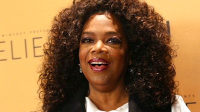 In this Wednesday, Oct. 14, 2015, file photo, Oprah Winfrey attends the premiere of the Oprah Winfrey Network's (OWN) documentary series 'Belief,' at The TimesCenter in New York. Winfrey is headed to the supermarket aisle with her own line of refrigerated soups and side dishes. The media mogul is launching the food line, called O, That's Good!, after creating a joint venture with Kraft Heinz Co.