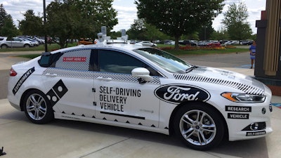This Friday, Aug. 24, photo, shows the specially designed delivery car that Ford Motor Co. and Domino’s Pizza will use to test self-driving pizza deliveries, at Domino’s headquarters in Ann Arbor, Mich. Ford and Domino’s are teaming up to test how consumers react if a driverless car delivers their pizzas.