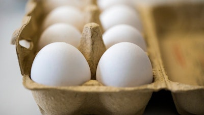 In this photo taken Monday, Aug. 7, 2017 Eggs are kept fresh in an egg-box in a laboratory of the Chemical and Veterinary Investigation Office in Krefeld, Germany. Dutch investigators detained two men Thursday who are suspected of being involved in the illegal use of pesticide at poultry farms that sparked a massive food safety scare in several European countries.