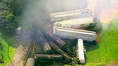 In this aerial image made from a video provided by WPXI, smoke rises in the air after dozens of cars of a freight train carrying hazardous materials derailed in Hyndman, Pa., Wednesday, Aug. 2, 2017. County officials ordered all residents of the small Pennsylvania town to evacuate after the derailment.