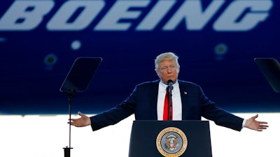 In this Feb. 17, 2017, file photo, President Donald Trump to speaks to Boeing employees in the final assembly building at Boeing South Carolina in North Charleston, S.C. The Air Force, which has been looking for ways to lower the cost of new planes for Air Force One, confirmed on Tuesday, Aug. 1, that it is talking to Boeing about buying two jumbo jets that were ordered but never delivered to a now-defunct Russian airline.