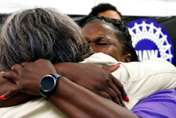 United Auto Workers members, some Nissan employees and supporters console one another as they express their disappointment at losing their bid to form a union at the Nissan vehicle assembly plant in Canton, Miss., Friday, Aug. 4, 2017.