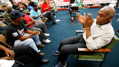 Actor and human rights activist Danny Glover, applauds with UAW members and Nissan employees at the UAW Canton, Miss., headquarters during a workers' rally, near the Nissan vehicle assembly plant, Tuesday, Aug. 1, 2017. Glover participated in the small rally to maintain workers' morale, while UAW workers set up an informational line outside employee entrances at the Nissan plant. The UAW has a vote scheduled Aug. 3-4, on whether it should represent the 3,700 full time company workers.