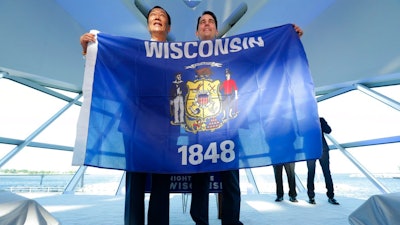 Wisconsin Governor Scott Walker (right) stands with Foxconn's chairman Terry Gou.