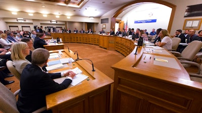 The Assembly Committee on Jobs and Economy meets about the incentive deal for Taiwan-based Foxconn Technology Group, Thursday, Aug. 3, 2017, at the state Capitol in Madison, Wis. The company last week that it planned to construct the first liquid crystal display panel factory outside of Asia in southeast Wisconsin. The deal requires the state to approve $3 billion in tax breaks tied to Foxconn hiring and spending as promised.