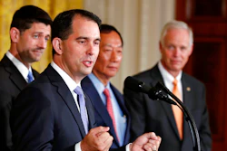 In this July 26, 2017, file photo, Wisconsin Gov. Scott Walker speaks in the East Room accompanied by House Speaker Paul Ryan of Wisconsin, left, Foxconn CEO and founder Terry Gou, and Sen. Ron Johnson, R-Wis., at the White House in Washington. Foxconn Technology Group is being enticed to come to Wisconsin with numerous regulatory waivers that are raising concerns from environmentalists wary of the company’s reputation in China, where company has been accused of pollution.