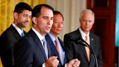In this July 26, 2017, file photo, Wisconsin Gov. Scott Walker speaks in the East Room accompanied by House Speaker Paul Ryan of Wisconsin, left, Foxconn CEO and founder Terry Gou, and Sen. Ron Johnson, R-Wis., at the White House in Washington. Foxconn Technology Group is being enticed to come to Wisconsin with numerous regulatory waivers that are raising concerns from environmentalists wary of the company’s reputation in China, where company has been accused of pollution.