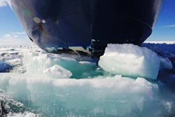 The bow of the Finnish icebreaker MSV Nordica pushes down sea ice as it traverses the Arctic's Northwest Passage through the Canadian Arctic Archipelago, Friday, July 21, 2017. Sailing through the Northwest Passage could potentially cut the distance from East Asia to Western Europe by more than 10,000 kilometers (6,200 miles), compared with the traditional route through the Panama Canal, offering huge fuel savings for thirsty ships. But it's not without hurdles.