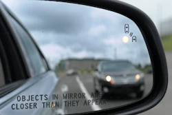 In his May 22, 2012 file photo, a side mirror warning signal in a Ford Taurus at an automobile testing area in Oxon Hill, Md. Safety systems to prevent cars from drifting into another lane or warn drivers of vehicles in their blind spots are beginning to live up to their potential to significantly reduce crashes, according to two studies released Wednesday, Aug. 23, 2017.