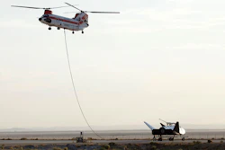 Sierra Nevada Corp's 'Dream Chaser' test spacecraft is prepared to be lifted by a helicopter for a test at Edwards Air Force Base, Calif. on Wednesday, Aug. 30, 2017.