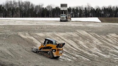 In this Jan. 25, 2017 file photo, heavy equipment is used at an ash storage site at Gallatin Fossil Plant in Gallatin, Tenn. The Environmental Protection Agency (EPA) says it plans to scrap an Obama-era measure limiting water pollution from coal-fired power plants. A letter from EPA Administrator Scott Pruitt released Monday, Aug. 14, 2017, as part of a legal appeal says he will seek to revise the 2015 guidelines mandating increased treatment for wastewater from steam electric power generating plants.
