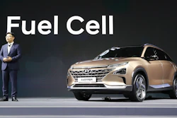 Hyundai Motor Co.'s Director Ryu Chang-sung speaks near Hyundai Motors' new hydrogen fuel cell vehicle during a media preview in Seoul, South Korea, Thursday, Aug. 17, 2017. Hyundai Motor says its new hydrogen fuel cell vehicle will travel more than 580 kilometers (360 miles) between fill-ups.