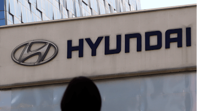 In this April 26, 2017 file photo, the logo of Hyundai Motor Co. is displayed at the automaker's showroom in Seoul, South Korea. Hyundai Motor Co. said Wednesday, Aug.30, 2017, that it resumed production at its plants in China where the automaker has been working to resolve a dispute with a parts supplier that led to a complete production halt.