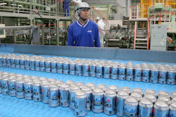In this Monday, May 29, 2017 photo, Asahi Breweries plant manager Shinichi Uno watches the production line at an Asahi Breweries factory in Moriya near Tokyo. The human job is to make sure the machines do the work right, and to check on the quality the sensors are monitoring. “Basically, nothing goes wrong. The lines are up and running 96 percent,” says Uno. “Although machines make things, human beings oversee the machines.”