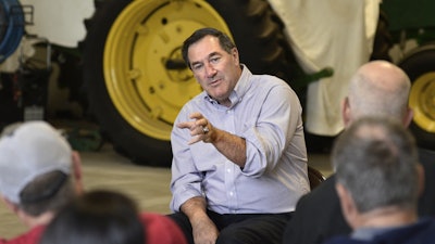 Indiana Sen. Joe Donnelly answers questions from local tomato farmers during a Farm Bill listening session at Carey Farms, Jonesboro, Ind., on Monday, Aug. 28, 2017.