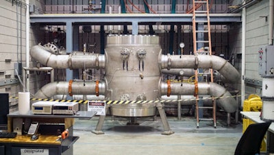 The new world-record magnet connected to cooling water pipes. Some 4,275 gallons of cold water flush through it per minute to keep it cool.