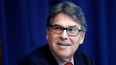 In this July 18, 2017, file photo, Energy Secretary Rick Perry attends a news conference at the National Press Club in Washington. The Energy Department said Wednesday, Aug. 23, the government should make it easier and cheaper to operate power plants, including coal and nuclear plants, to strengthen the nation's electric grid.