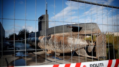 In this Tuesday, Aug. 22, 2017 photo, a private submarine sits on a pier in Copenhagen harbor, Denmark. Danish police say a DNA test from a headless torso found in the Baltic Sea matches with missing Swedish journalist Kim Wall, who is believed to have died on the private submarine.