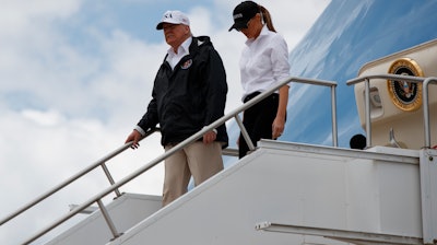 President Donald Trump and first lady Melania Trump arrive on Air Force One at Austin-Bergstrom International Airport in Austin, Texas, Tuesday, Aug. 29, 2017.