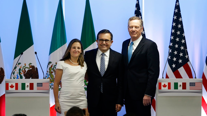 Canadian Foreign Affairs Minister Chrystia Freeland, from left, Mexico's Secretary of Economy Ildefonso Guajardo Villarreal, and U.S. Trade Representative Robert Lighthizer, pose for a group photo at a press conference regarding the second round of NAFTA renegotiations in Mexico City. Tuesday, Sept. 5, 2017.