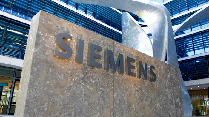 This June 24, 2016 file photo shows the logo of German industrial conglomerate Siemens at their headquarters in Munich, Germany. German industrial equipment maker Siemens AG said Tuesday Sept. 26, 2017, it has signed a memorandum of understanding to merge its train-building business with French rival Alstom, creating a 'new European champion' in the face of growing competition from China.