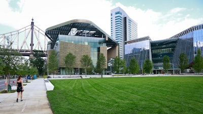 This Aug. 16, 2017, photo shows the main buildings of Cornell Tech - the main academic building called the Bloomberg Center, left, a 26-story residence hall, center, and a programs building called the Bridge, right, on Roosevelt Island in New York. The new graduate school that backers hope will cement New York's status as a center of high-tech innovation officially opens Wednesday, Sept. 13. The school called Cornell Tech is the product of a competition former Mayor Michael Bloomberg announced in 2011.
