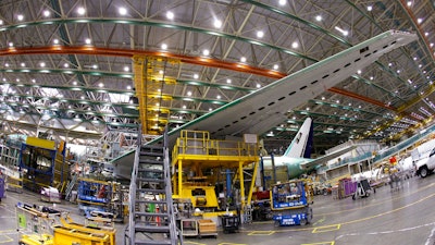 In this file photo dated Monday, June 12, 2017, a Boeing 777 plane on the assembly line in Everett, Washington. The World Trade Organization on Monday Sept. 4, 2017, rejected claims by the European Union against tax incentives provided by Washington state to Boeing, handing a victory to the U.S. plane maker.